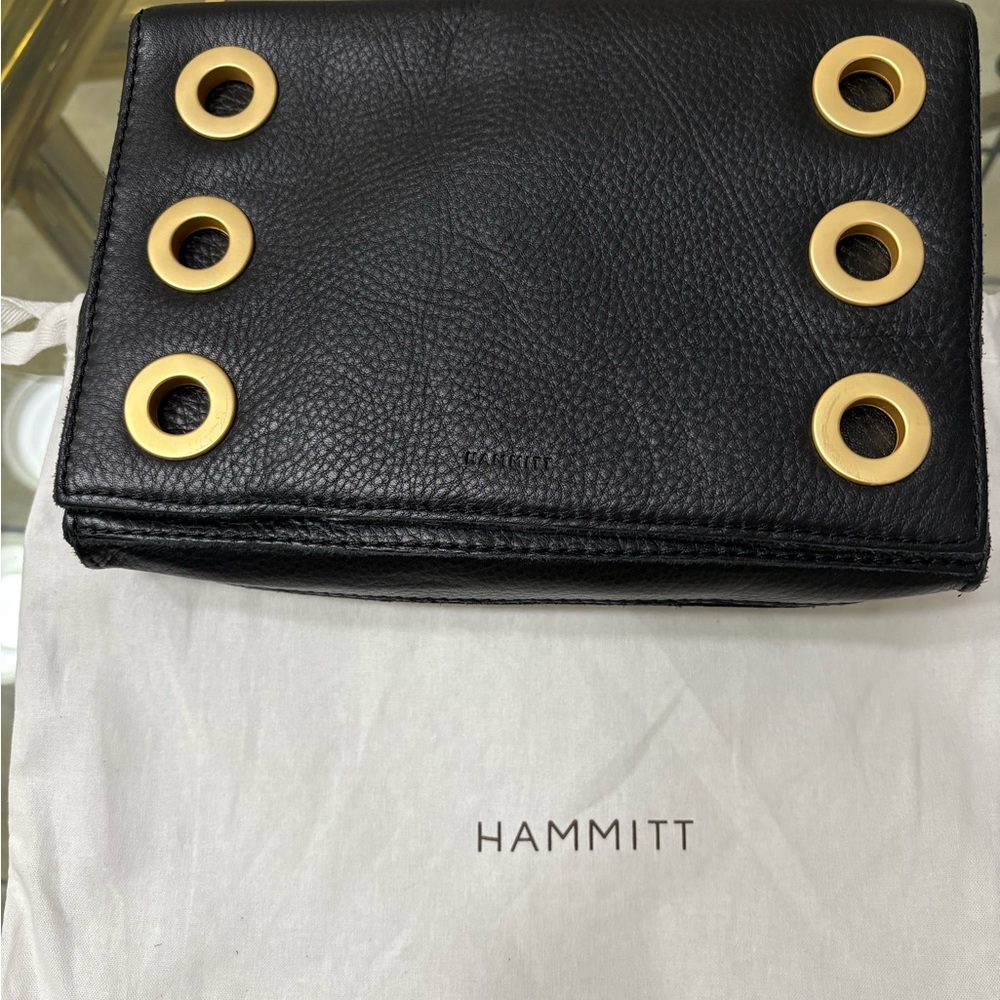 Hammitt Black and Gold Clutch with Grommet Details
